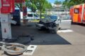 Car hits cyclist and crashes into gas station