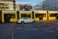 Motorcyclist trapped between car and tram